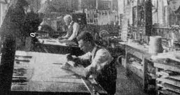 Two men at drafting benches in the Gibson engineering department, about 1920