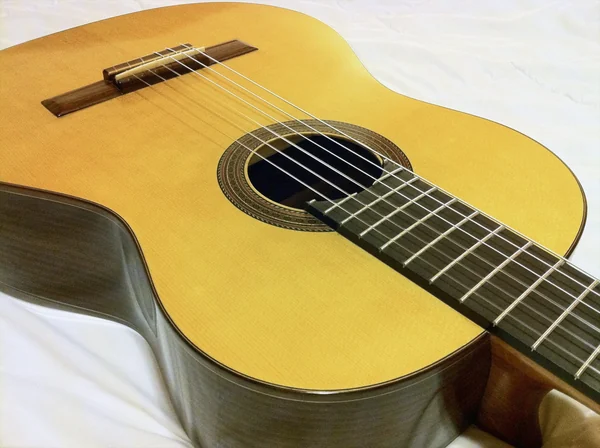 Classical guitar: spruce soundboard, rosette and bridge seen at an angle